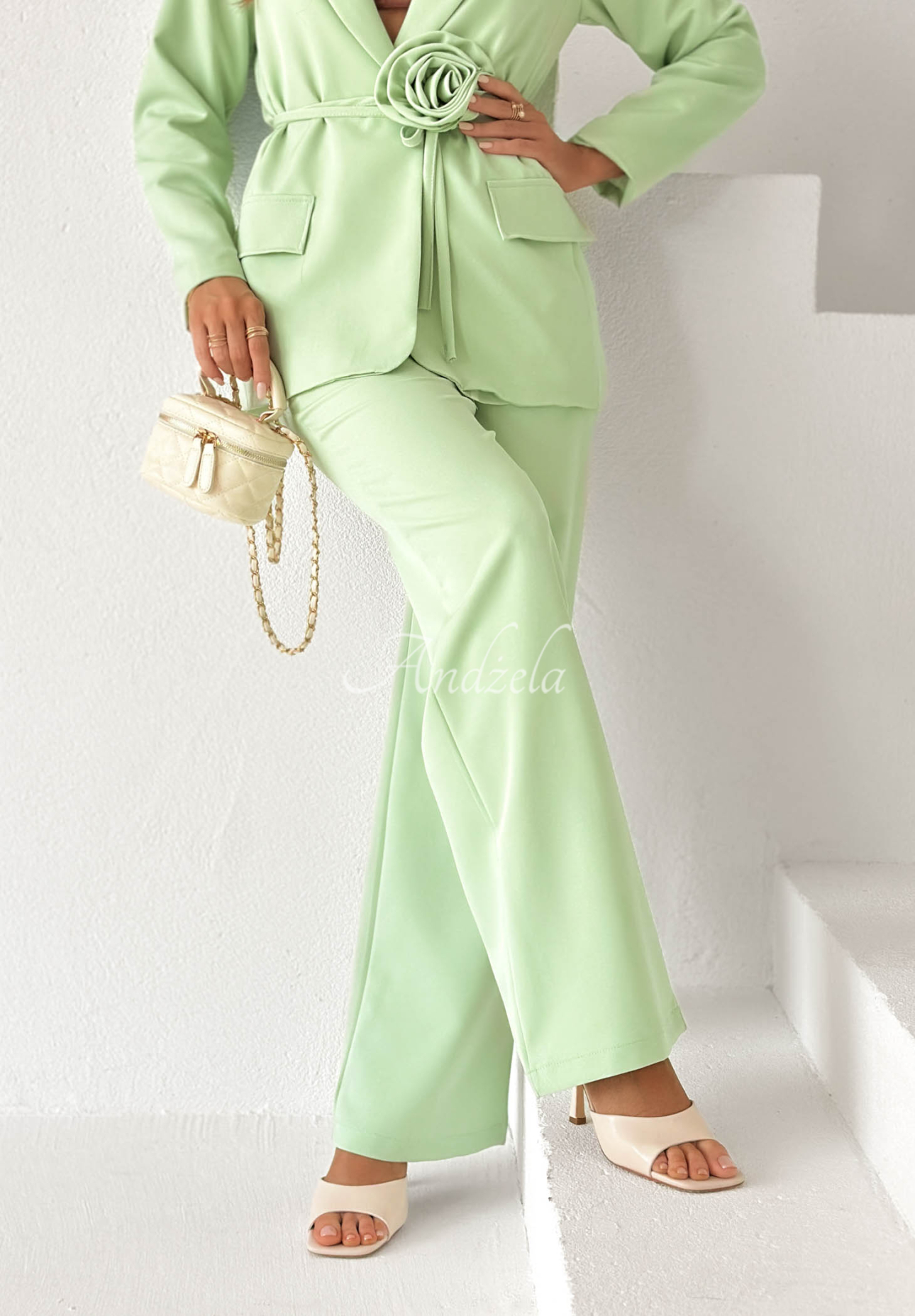 Elegant women's suit with a flower, Tessa pistachio