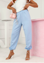 Kwieciste materiałowe spodnie Evela beżowe